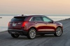 2019 Cadillac XT5 AWD in Red from a rear right three-quarter view